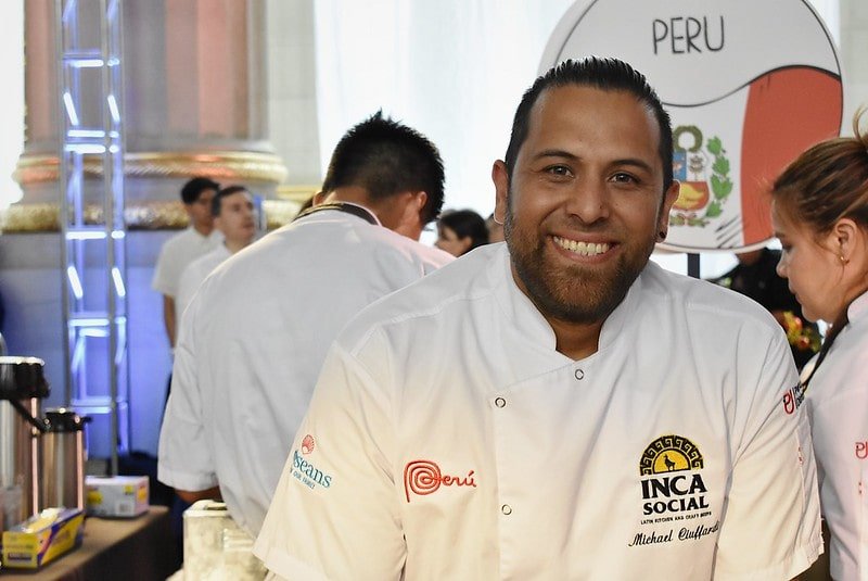 A Peruvian chef smiles for the camera at the 2025 Embassy Chef Challenge.