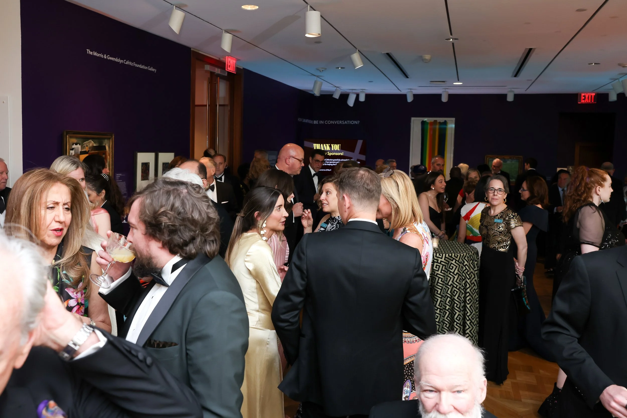 Guests mingling at an event for the Phillips Collection art gallery in washington DC. event produced by Stratus Firm, an event production company in DC
