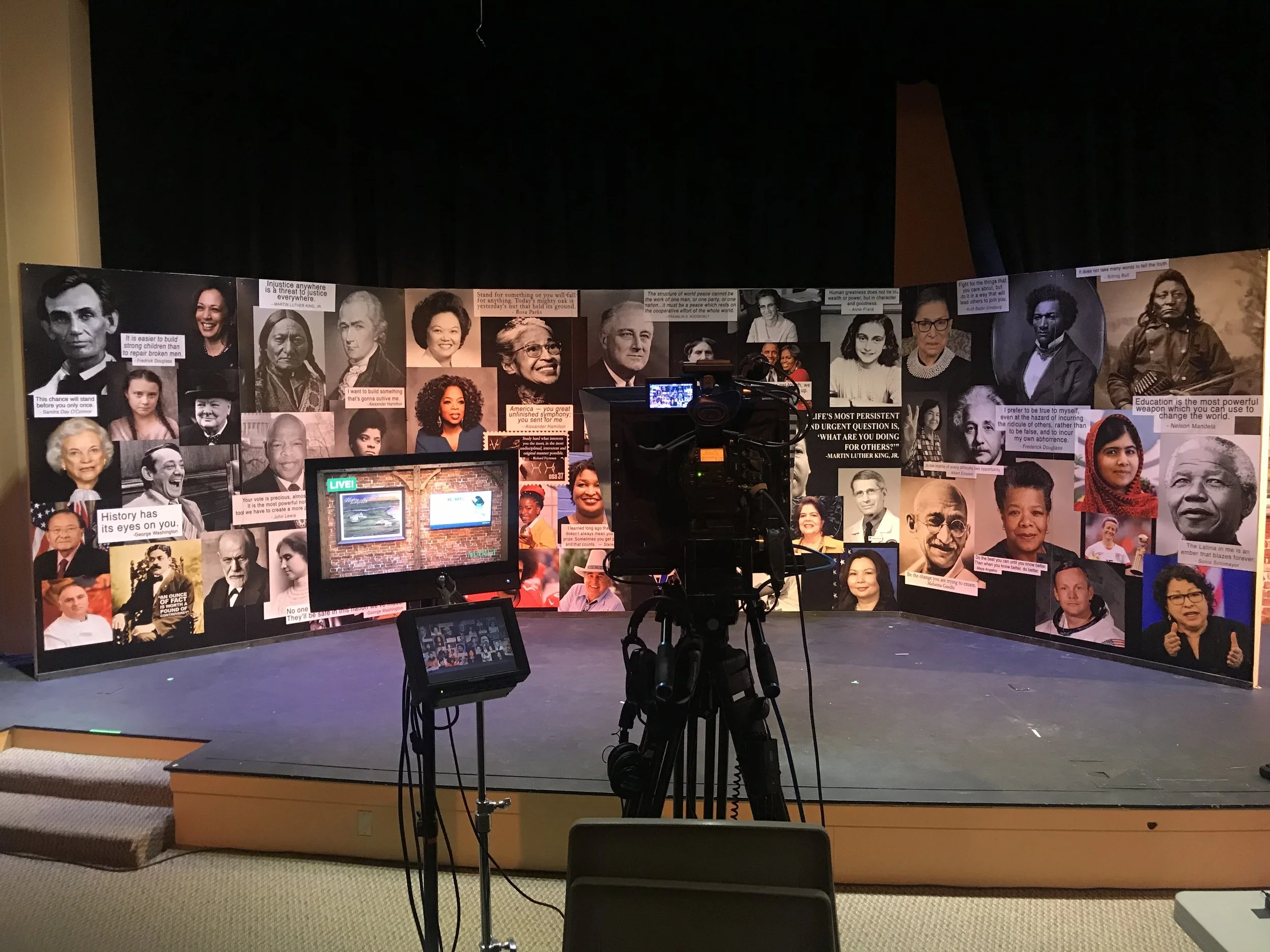 Stage set up for broadcast with images and quotes of famous people, event produced by Stratus Firm, an event production company in DC