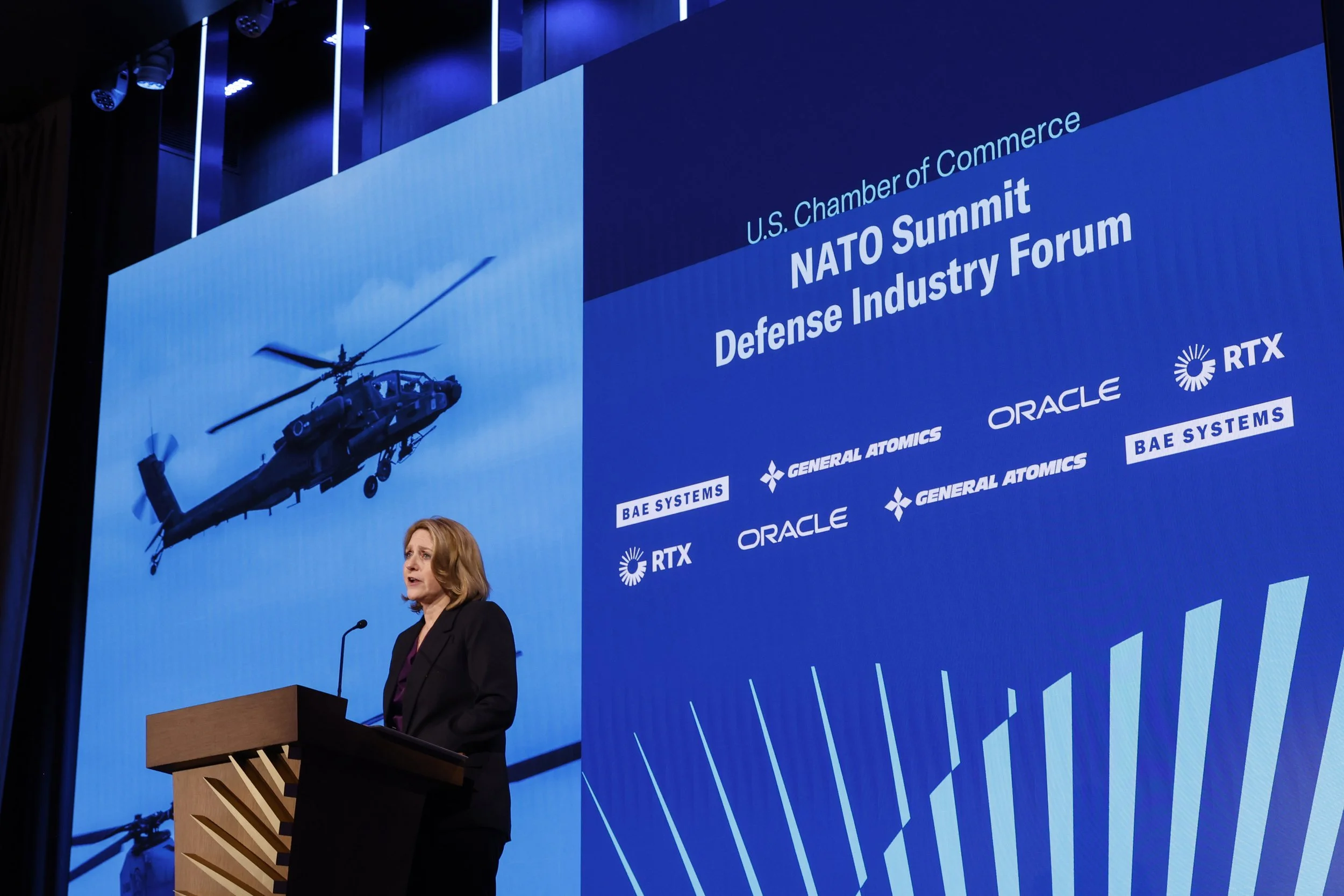 A woman speaks onstage at the U.S. Chamber of Commerce NATO Summit Defense Industry Forum. Photo © U.S. Chamber of Commerce