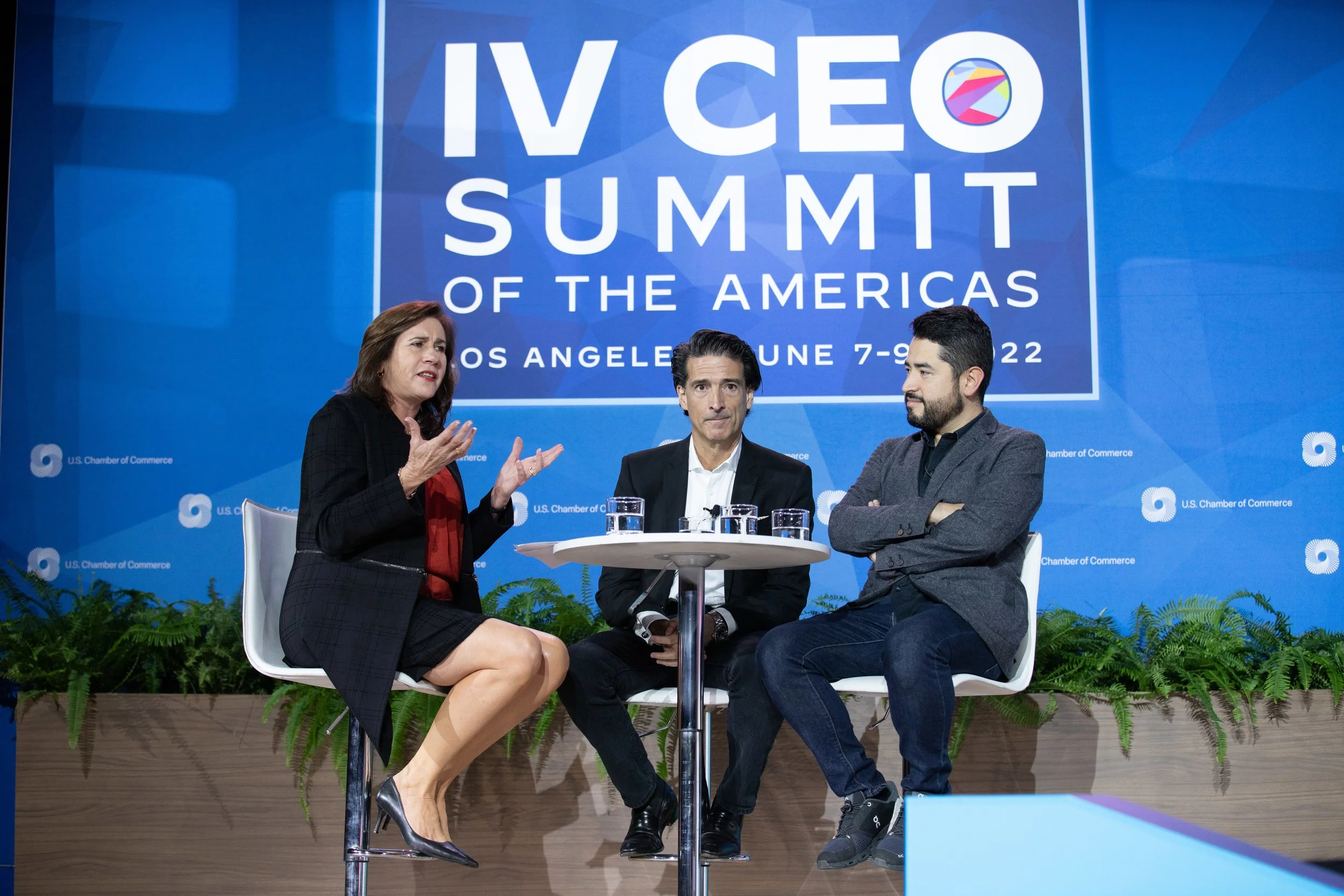 Three people sitting onstage at the IV CEO Summit of the Americas. Photo © U.S. Chamber of Commerce.