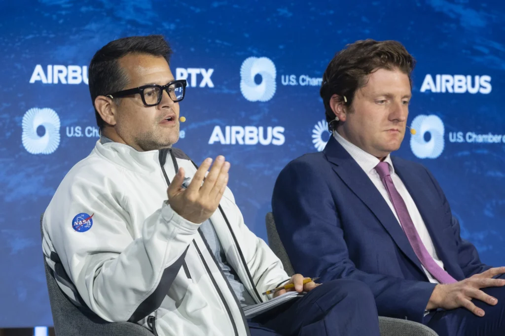 A member of NASA and a public official on stage at the Global Aerospace Summit in September 2025. The event was produced by Stratus Firm, an event production company located in Washington, DC