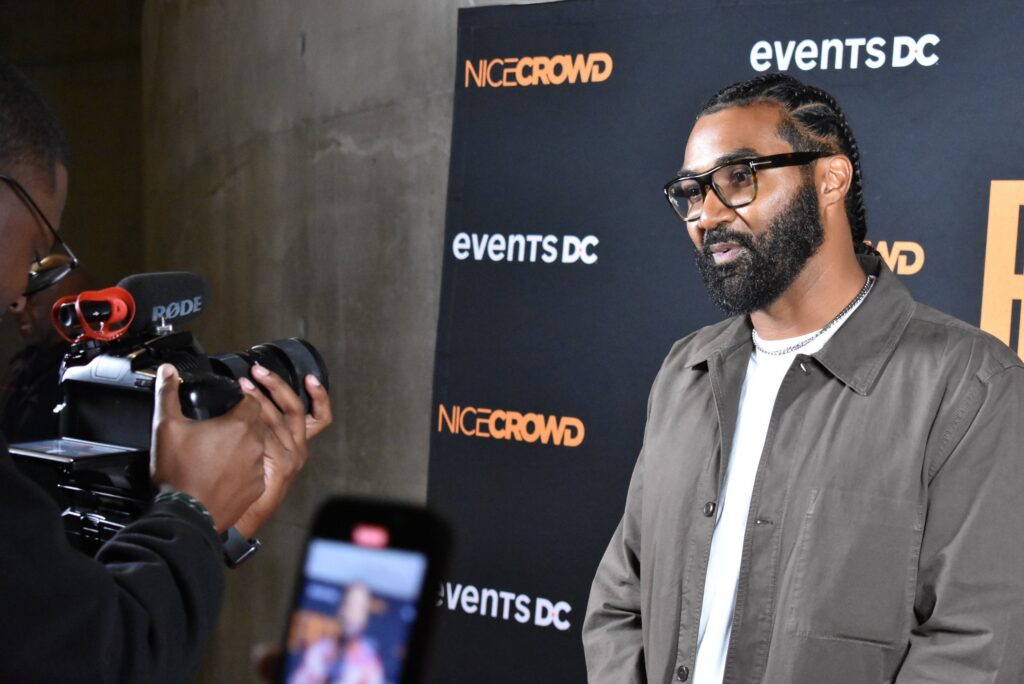 A man poses for a photo at the 2025 "Because They're Funny" Comedy Festival