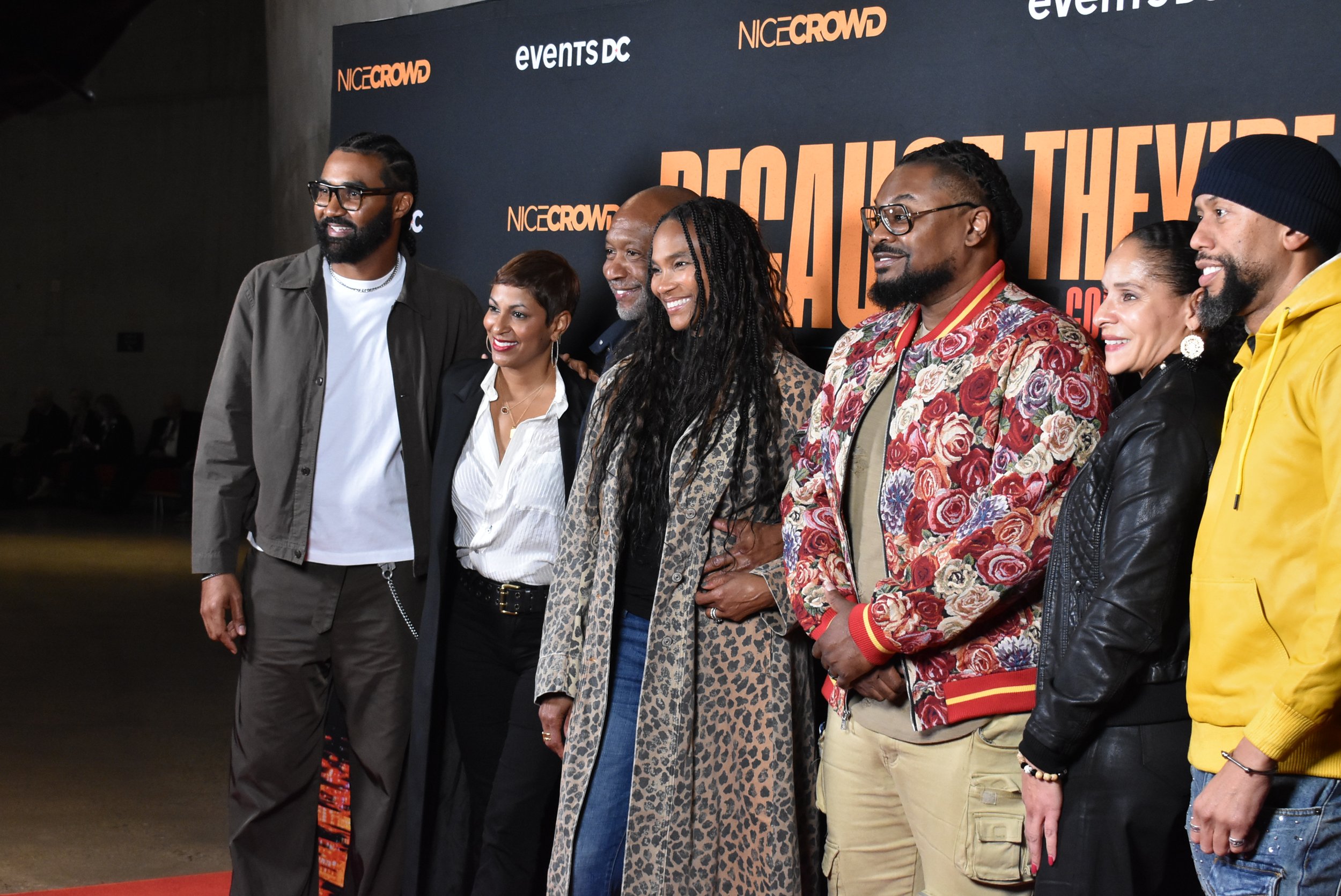 People pose for photos at the 2025 "Because They're Funny" Comedy Festival