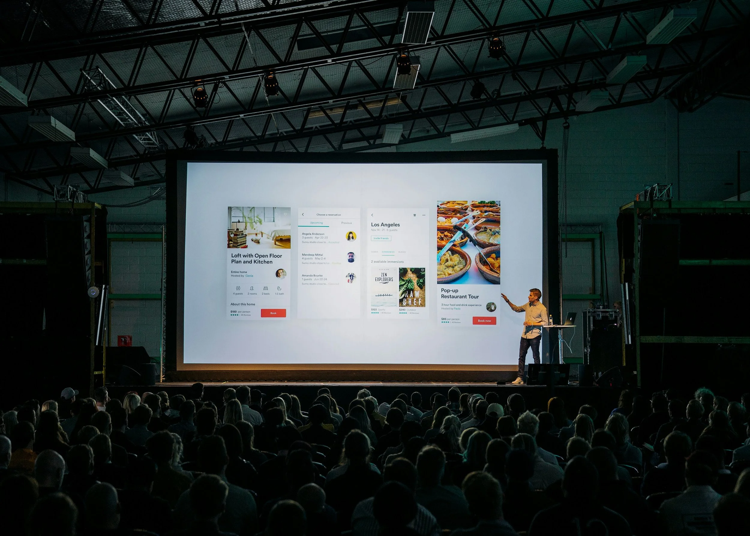 A speaker presents a product launch to a full audience.