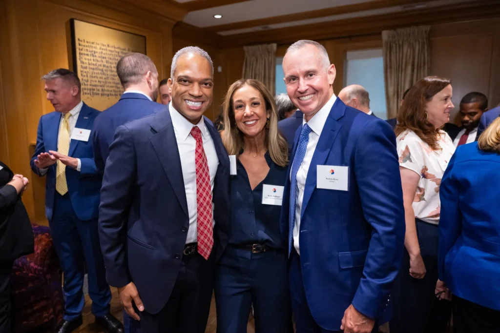 Three people smile for the camera at the 2025 Greater Washington Partnership Congressional Reception