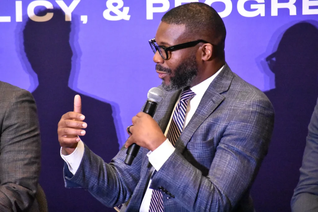 A man speaks into a mic at the Congressional Black Caucus Foundation's 2025 Annual Legislative Conference