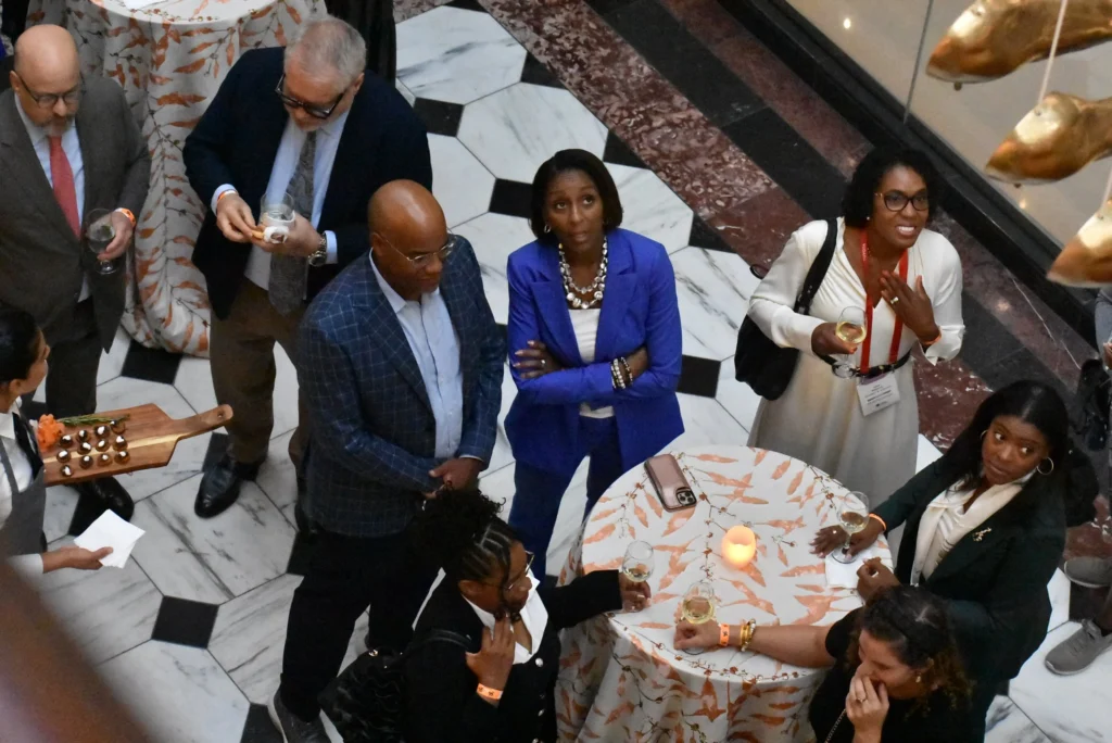 Guests look up at the decor and chat over drinks at the 2025 Congressional Black Caucus Foundation's Phoenix Awards Dinner