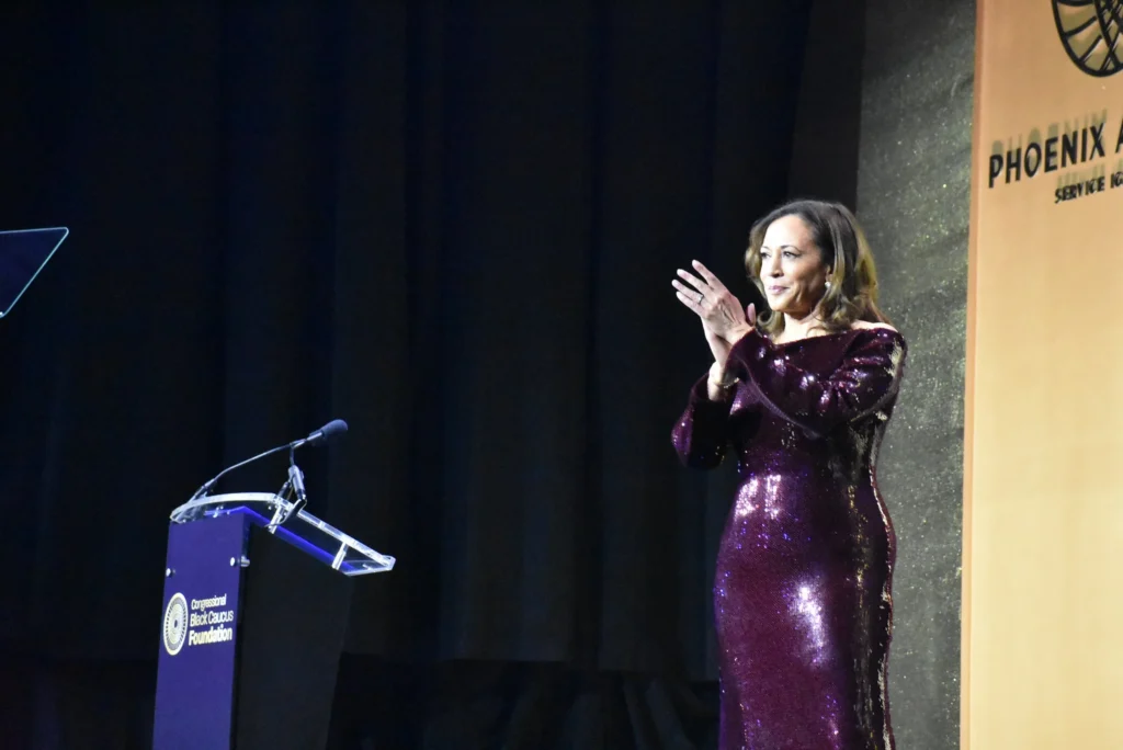 Kamala Harris applauds onstage at the 2025 Congressional Black Caucus Foundation's Phoenix Awards Dinner