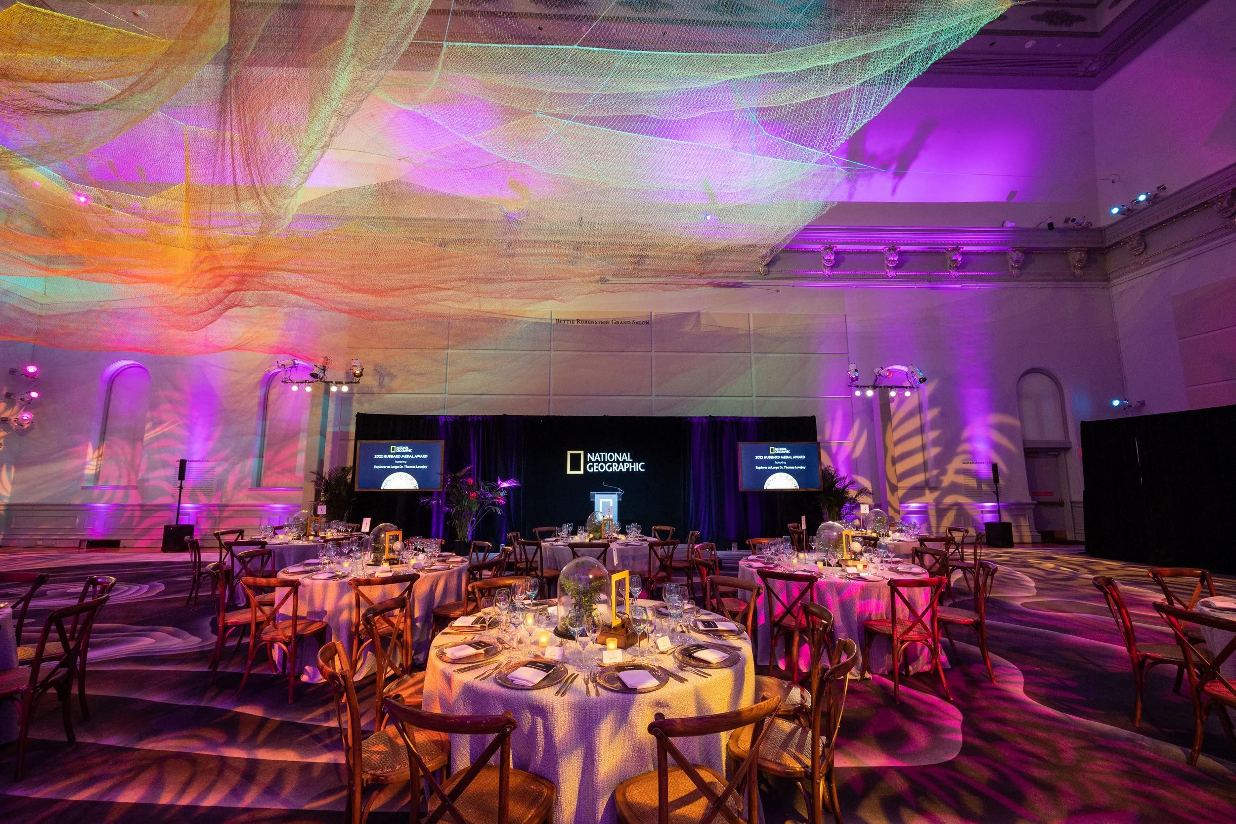 National Geographic gala seating and stage at the Renwick Gallery. Event produced by Stratus Firm, an event agency located in Washington, DC.