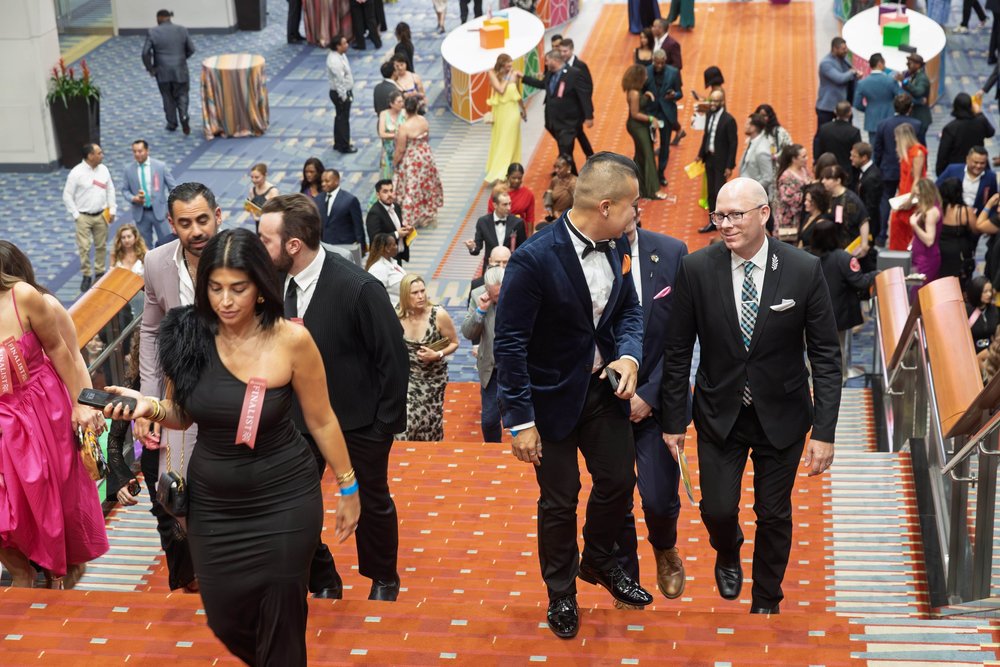 Event attendees progress up the stairs at the 2025 RAMMYS Awards afterparty.