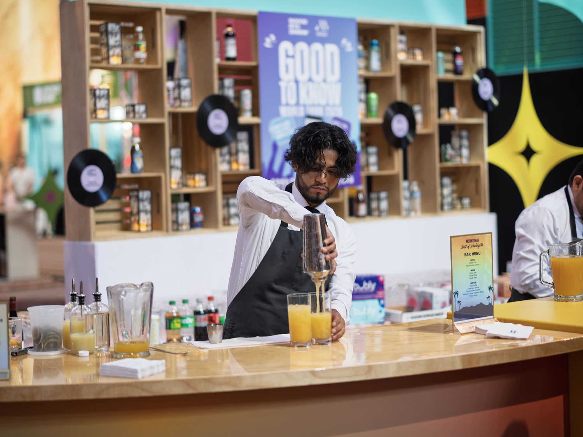 A bartender prepares a drink.