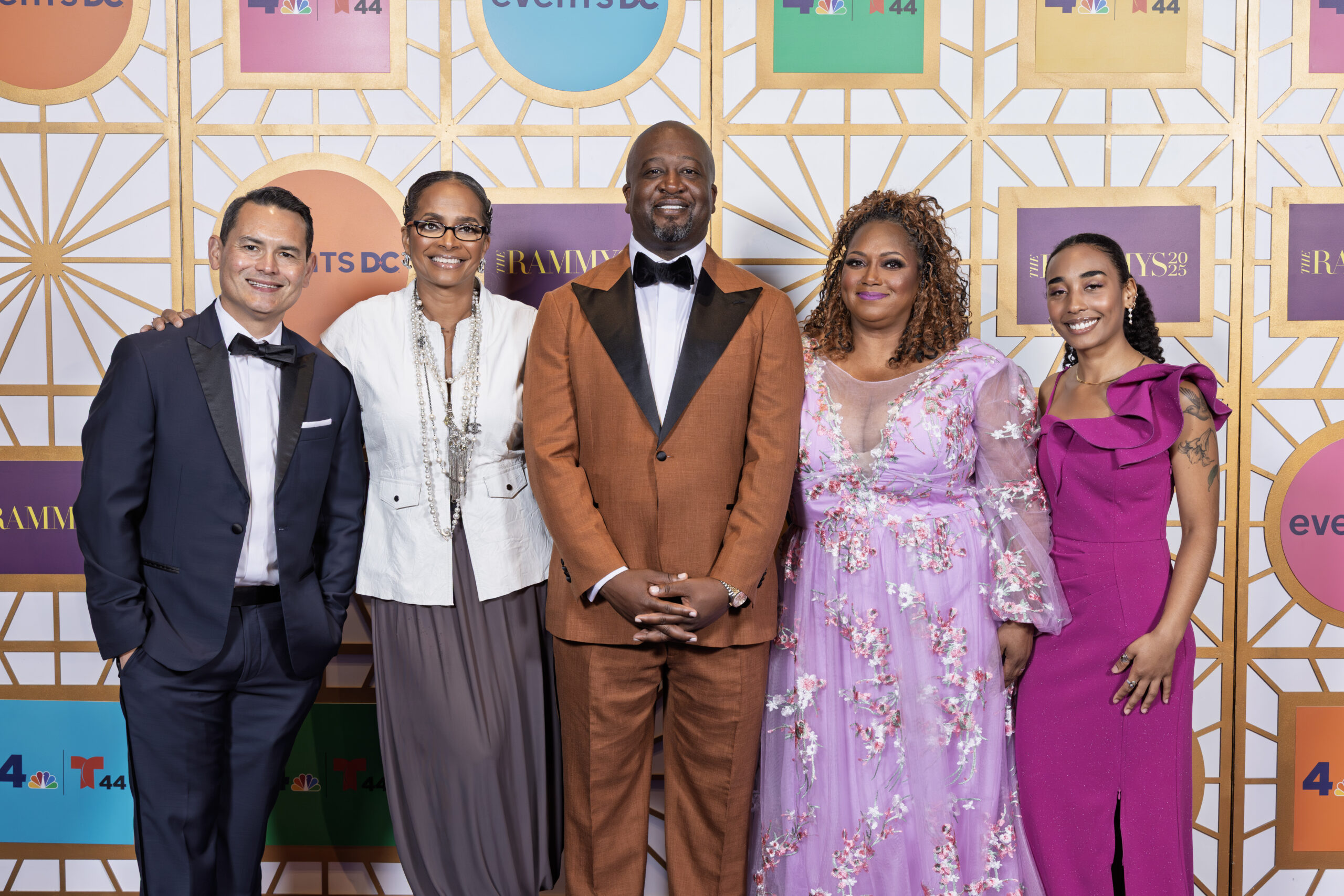 Five people stand in front of the step-and-repeat at the 2025 RAMMYS Awards.