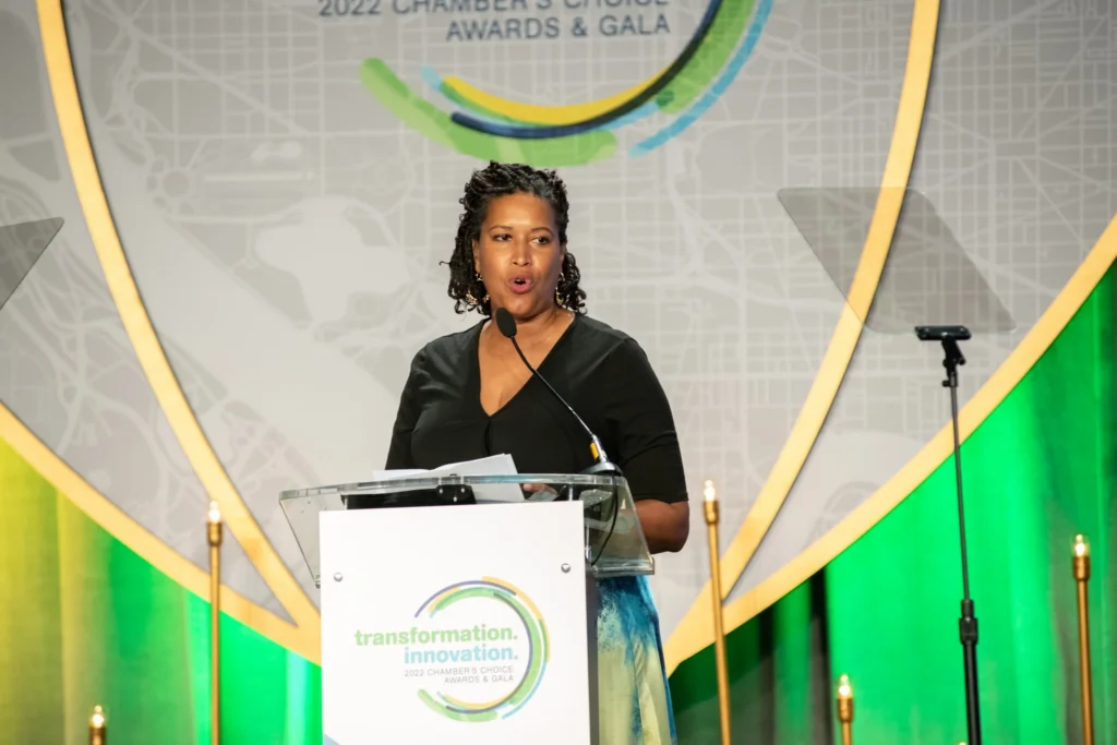 A woman speaks onstage at the 2022 Chamber's Choice Awards & Gala.