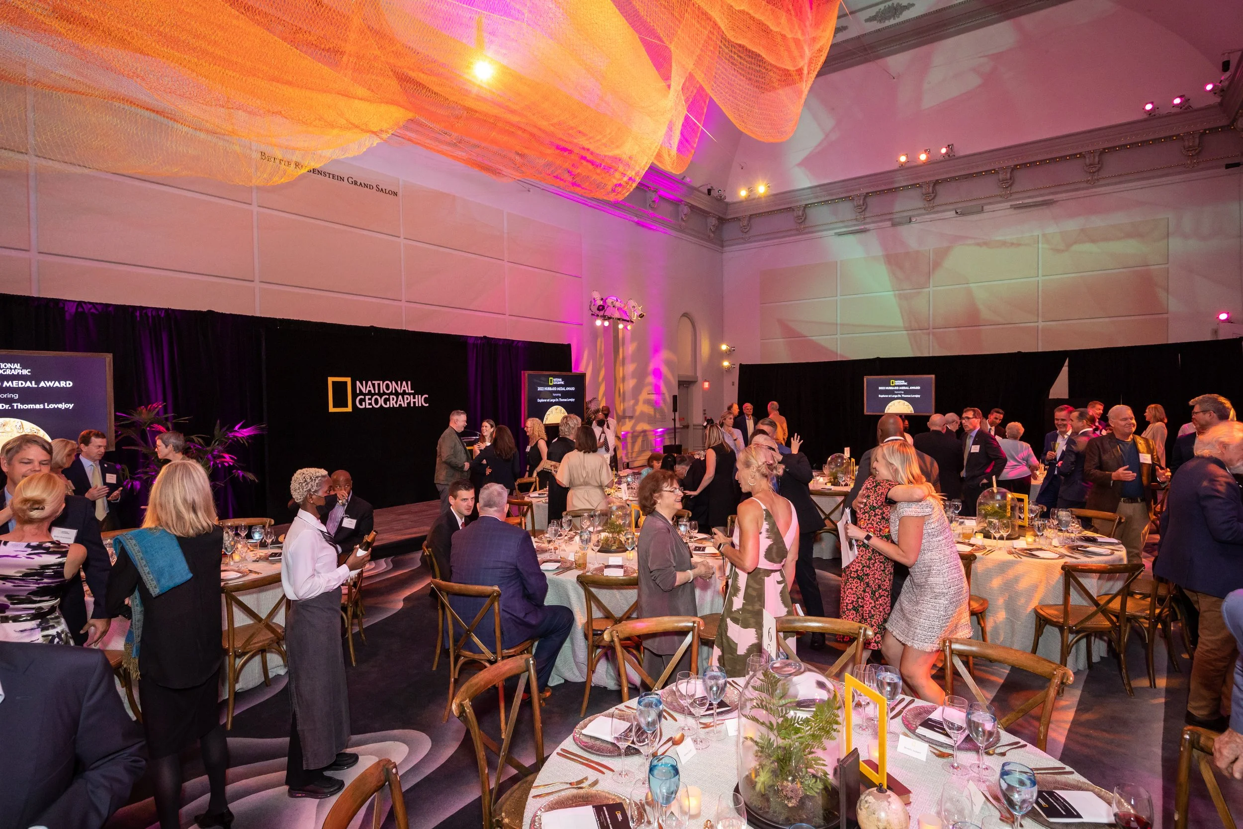 Attendees mingle at a National Geographic event.