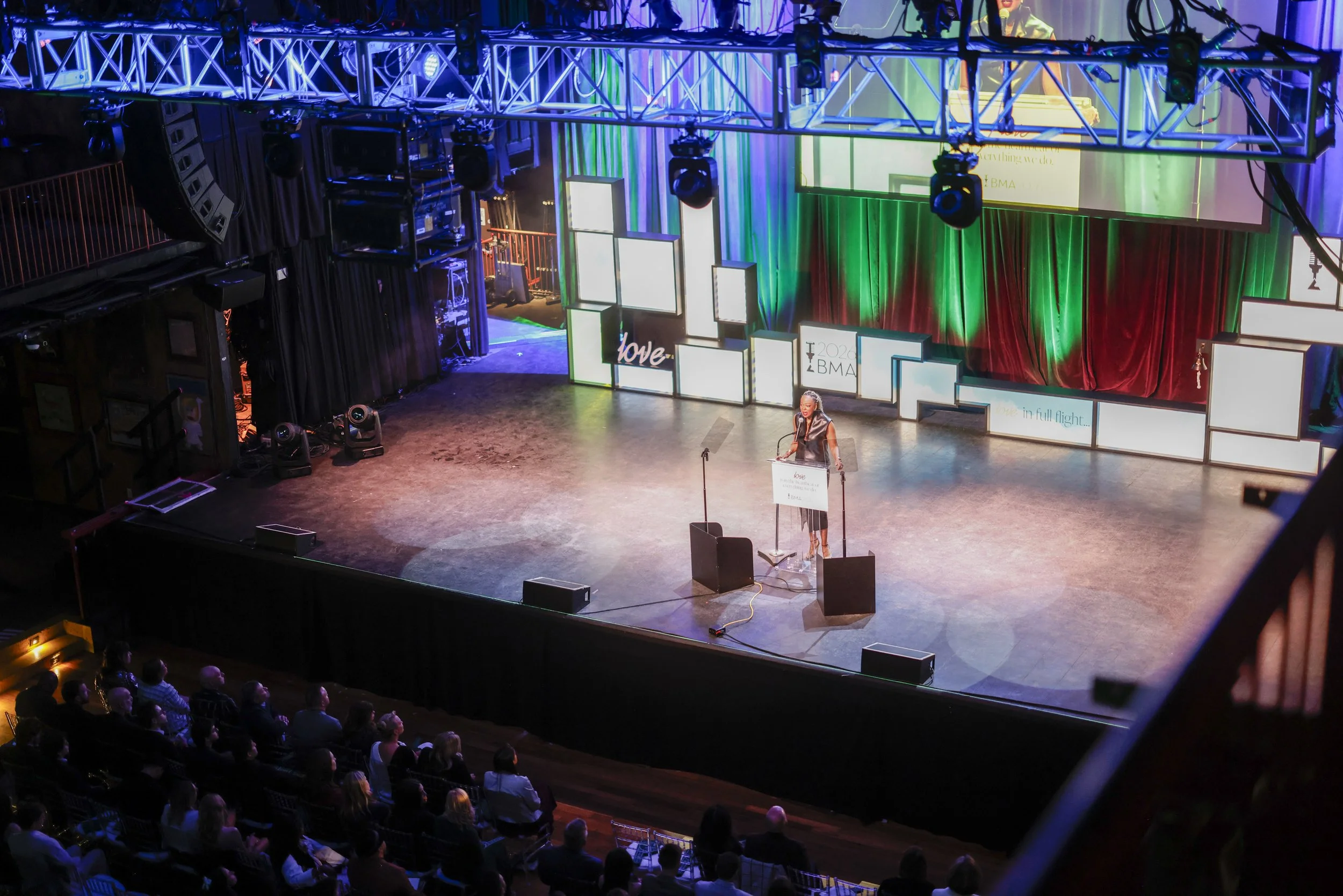 A speaker onstage addresses the audience at the 2026 BMAs.