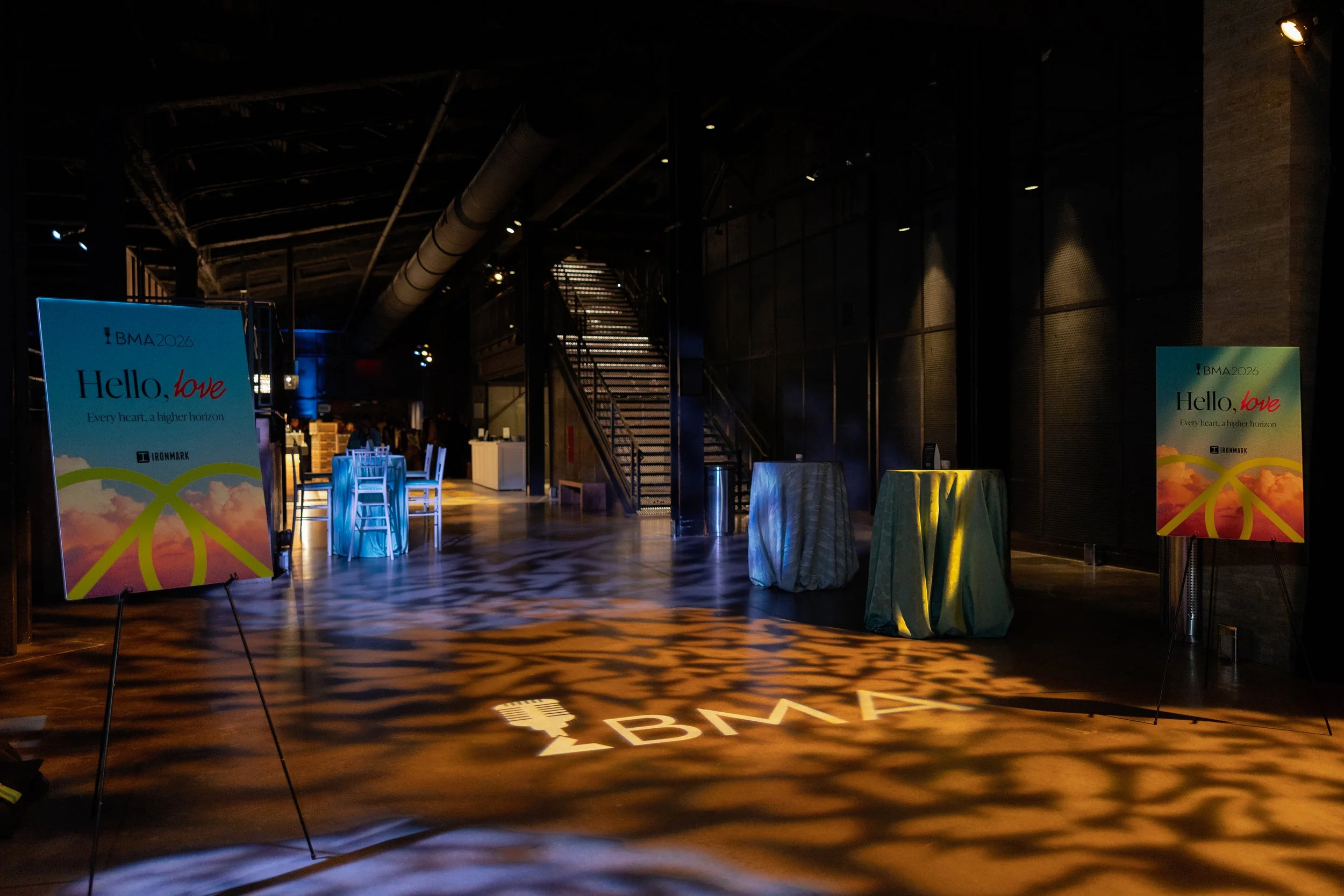Branded signage at the 2026 BMAs and a light projecting the event logo onto the floor.